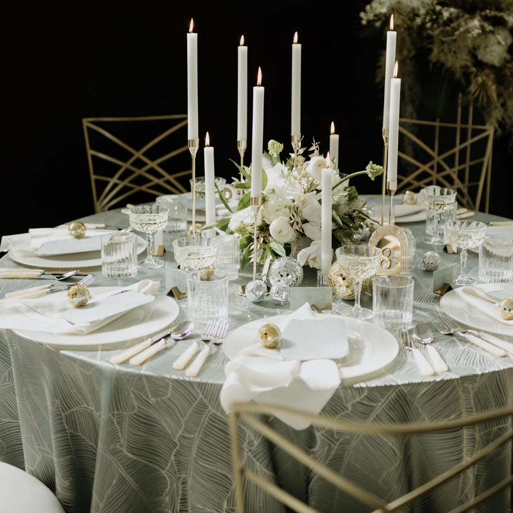 Nola White Dinner Napkins pair seamlessly with Palmers Slate Tablecloth.
