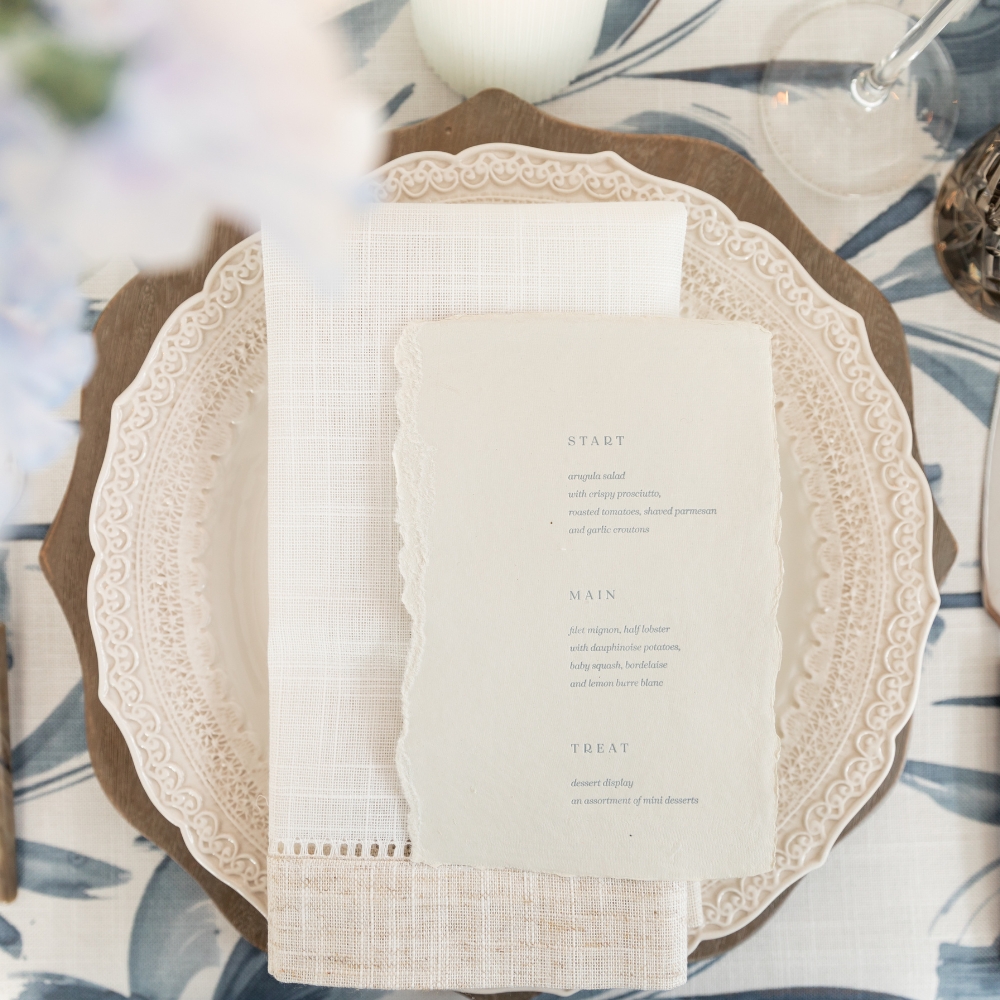 Hemstitch White & Flax Napkin and Livia Sapphire Floral Pattern Linen in rich indigo color.