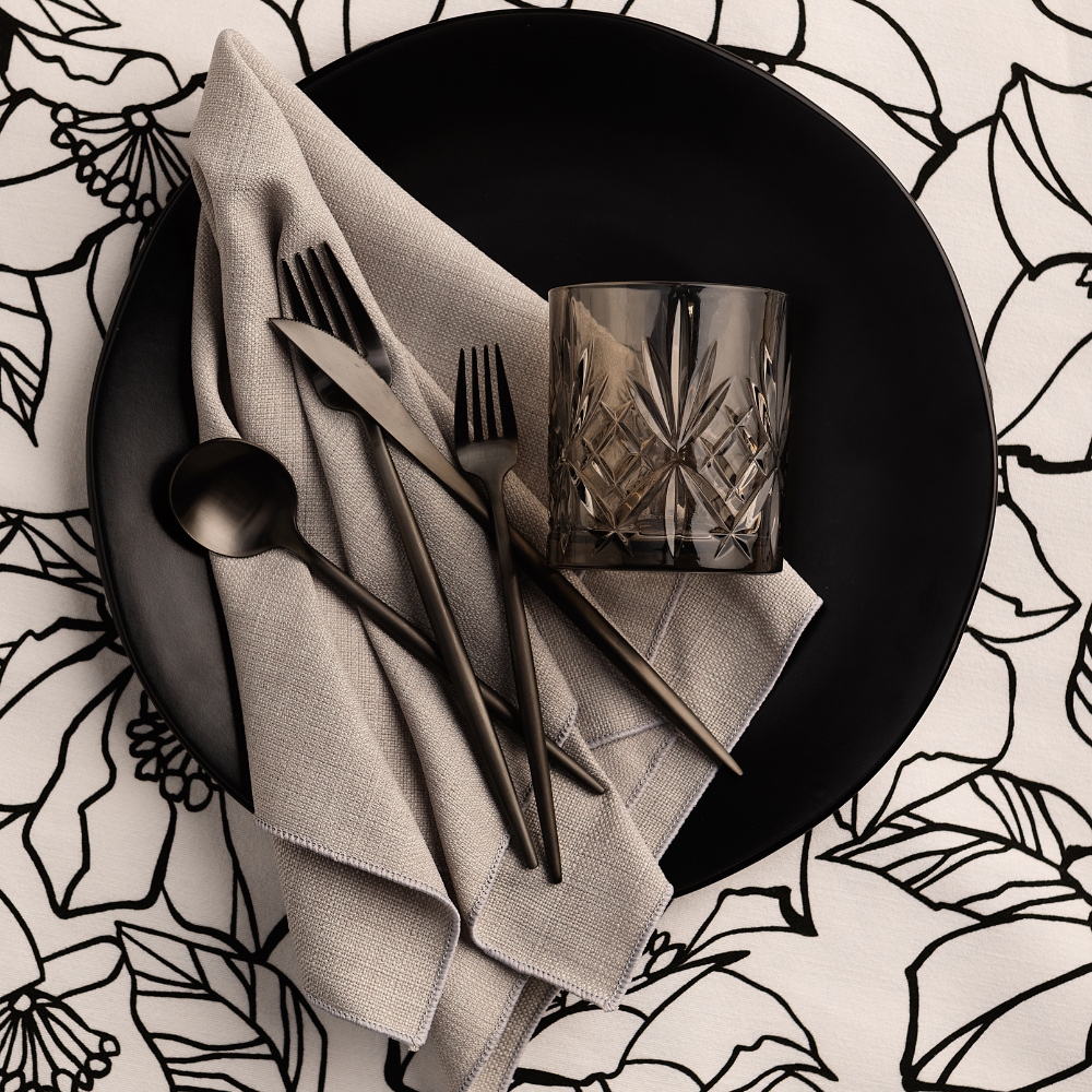 Nola Grey Dinner Napkin and Archie Black Floral Print Table Linen rentals.