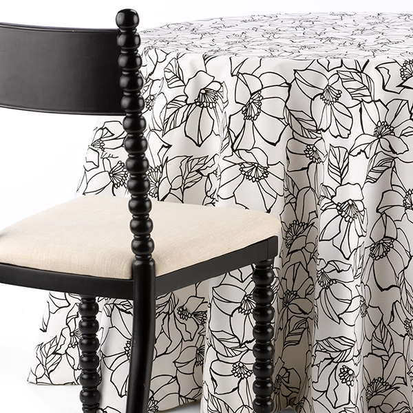 Archie Black Floral Table Linen with Selma Spool Chair.