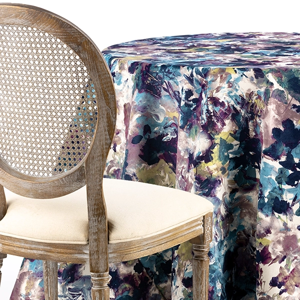 A chair next to the table with Bouquet Lapis Floral Table linen