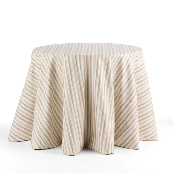 Davey Shoreline Sand Yellow Striped Tablecloth adds coastal charm to the table design.