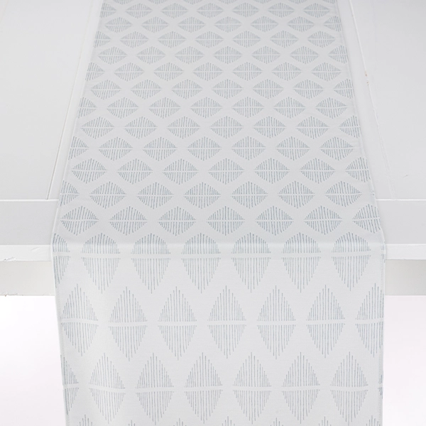A Diem Grey table runner with an elegant pattern on it, perfect for your table linen rental needs.