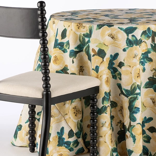A chair next to the table with Ophelia Lemon fabric