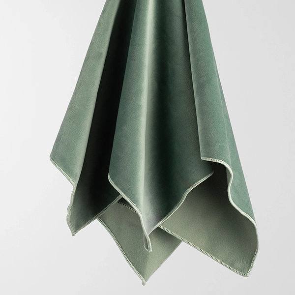Velvet Peacock Jade Dinner Napkin Rental has a lush and velvety texture and a warm jade color.