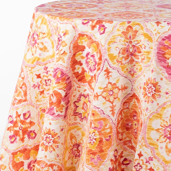 A Ali Tangerine table linen available for rental at events.