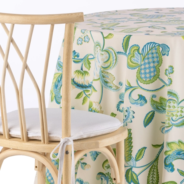 A chair next to the Borden Capri Blue Floral table linen