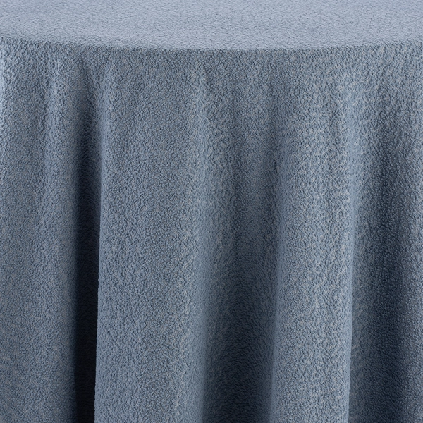 A close-up view of the Boucle Powder Blue tablecloth rental