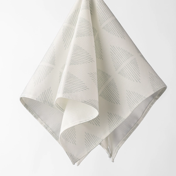 A Diem Grey Napkin with a triangle pattern available for event linen rental.