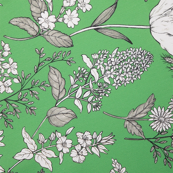 A Dixie Fern Green fabric with white flowers and leaves available for table linen rental.