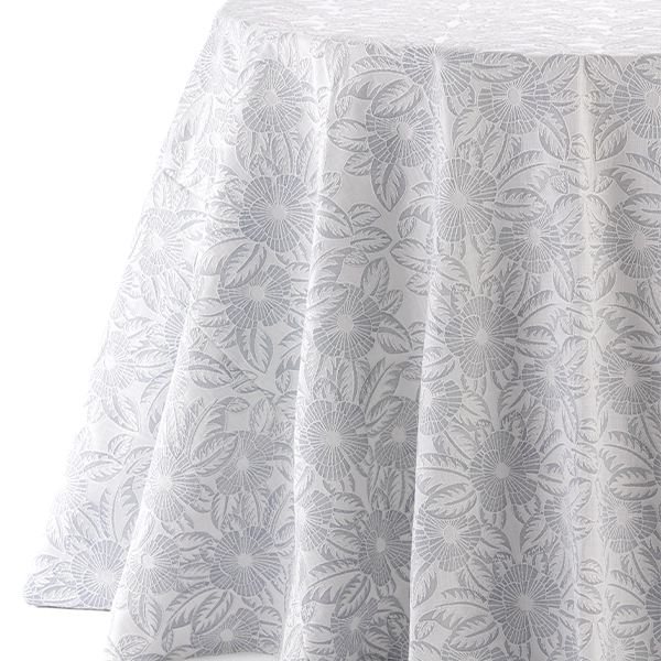 A round white tablecloth with a floral pattern available for Gracie French Grey linen rental.