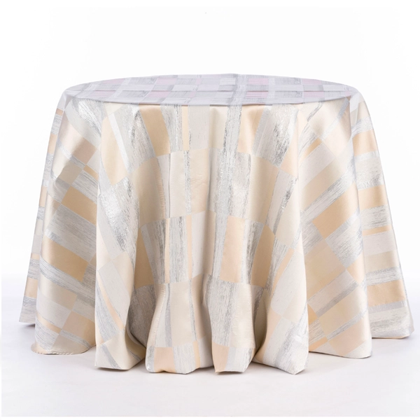 An event linen rental consisting of a round table covered in Metropolitan Champagne cloth.