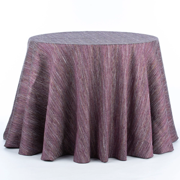 A round table dressed in Millennial Purple cloth, available for event linen rental or table linen rental.