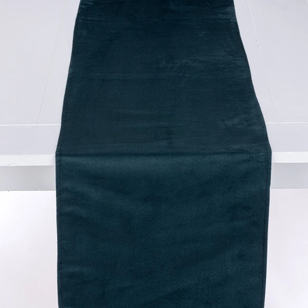 A black towel on a white surface, perfect for Montana Suede Navy Table Runner rental.