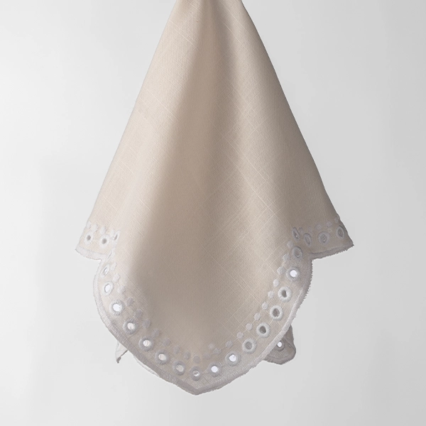 A Sadie Scalloped White Napkin with a white border available for event linen rental.