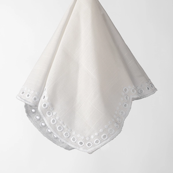 A Sadie Scalloped White Napkin available for table linen rental.