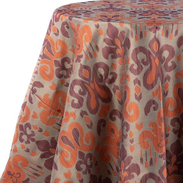 A view from the left on Sutra Beet purple orange patterned tablecloth rental