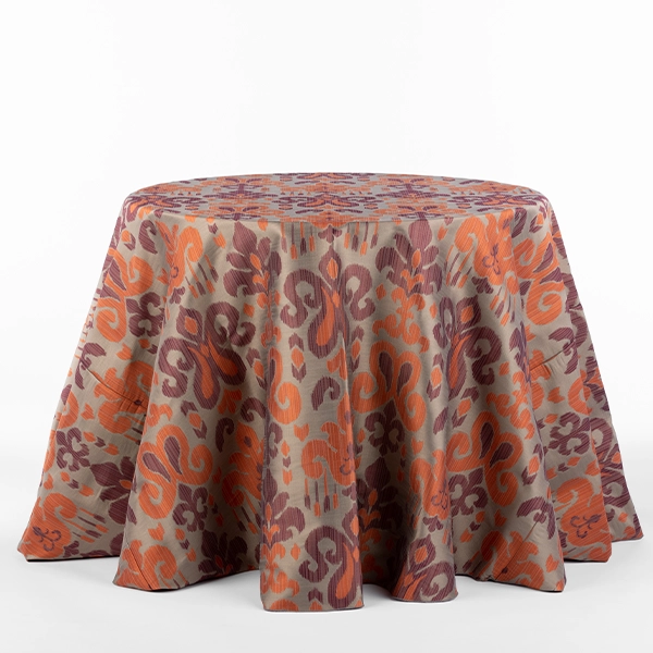 A view on the Sutra Beet purple orange patterned tablecloth rental in full size