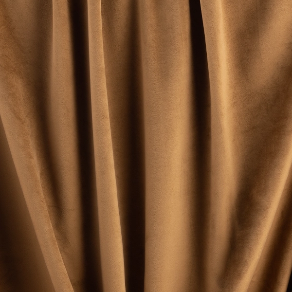 A close up of a Velvet Rust curtain used for event linen rental.