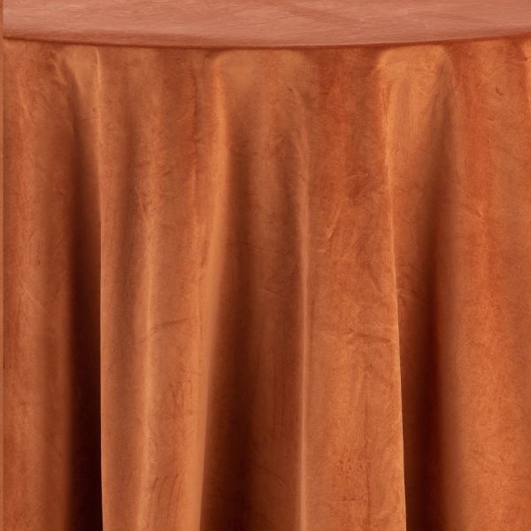 A table draped in Velvet Rust cloth, perfect for event linen rental.