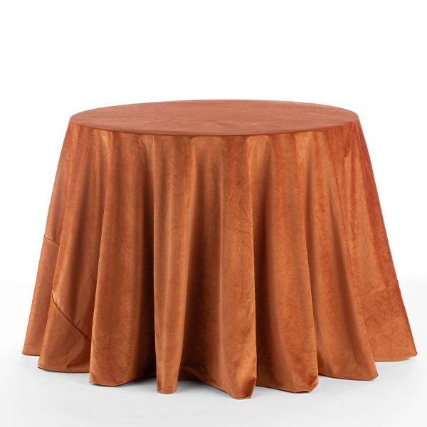 A round table covered in Velvet Rust cloth available for event linen rental.