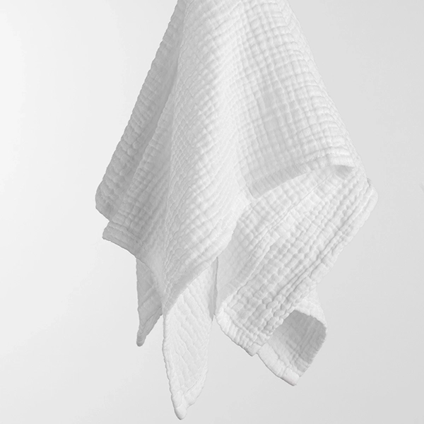 A white Callie Charcoal towel hanging from a hook.
