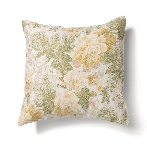 A Garden Rose Lemon pillow available for event linen rental.