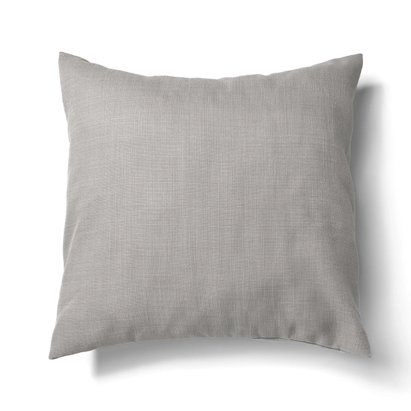 A Nola Grey Pillow on a table linen rental.