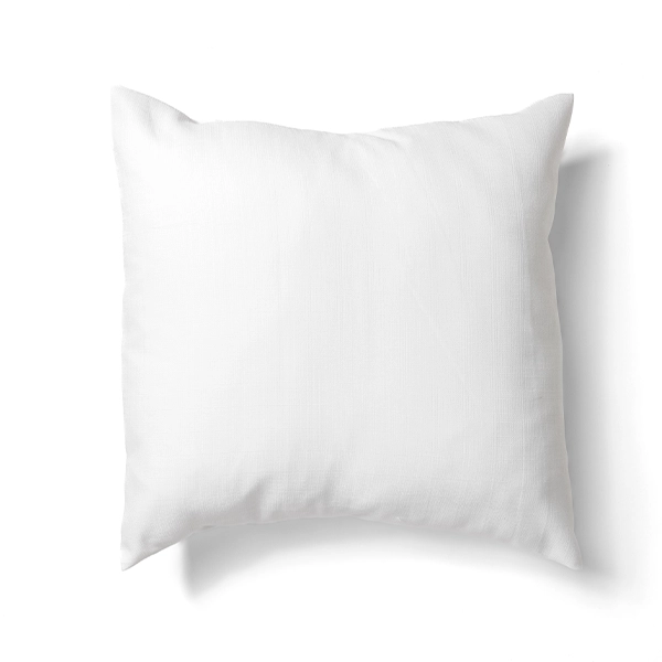 A Nola White Pillow on a table linen rental.