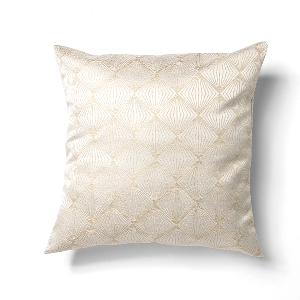 A Stella Champagne Pillow with a gold pattern available for event linen rental.