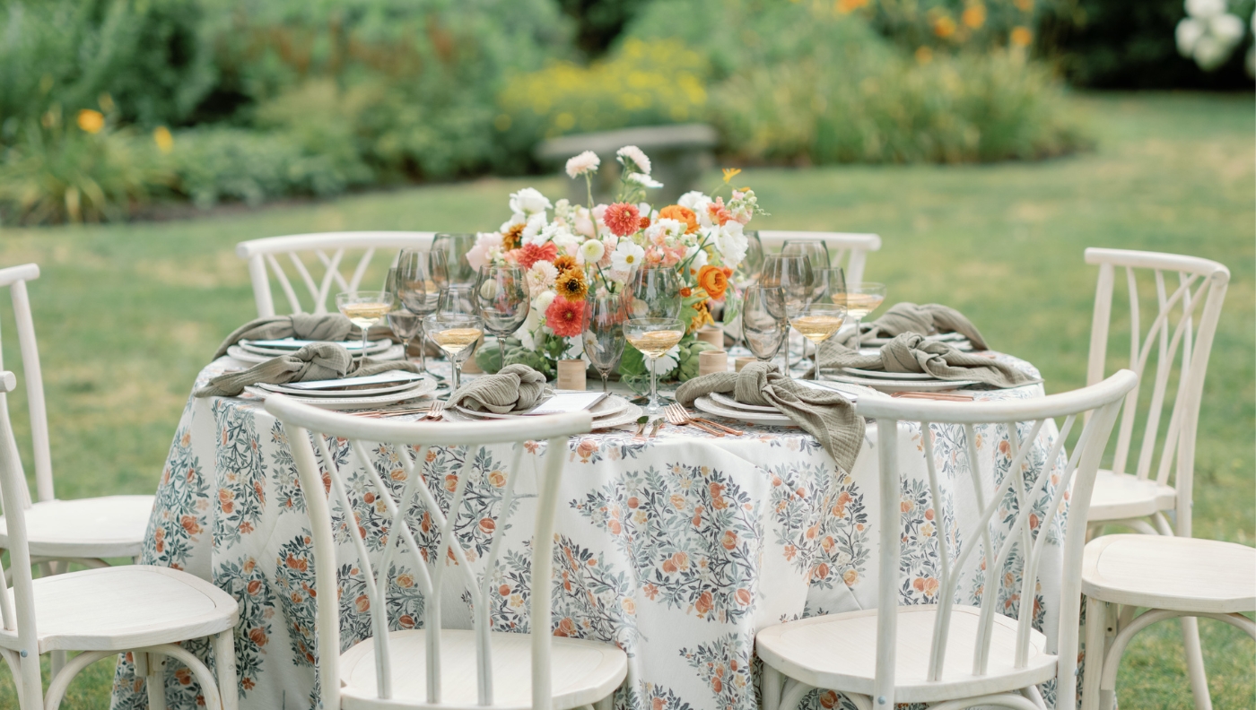 A beautifully arranged table set for a dinner party, featuring elegant linens available for event or table linen rental.
