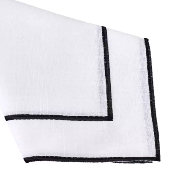 An elegant Lessing Black Stitch Napkin rental in white and black, perfect for events.