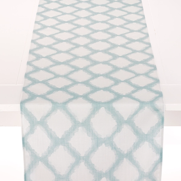 A white and blue Lexington Linen Table Runner available for table linen rental.