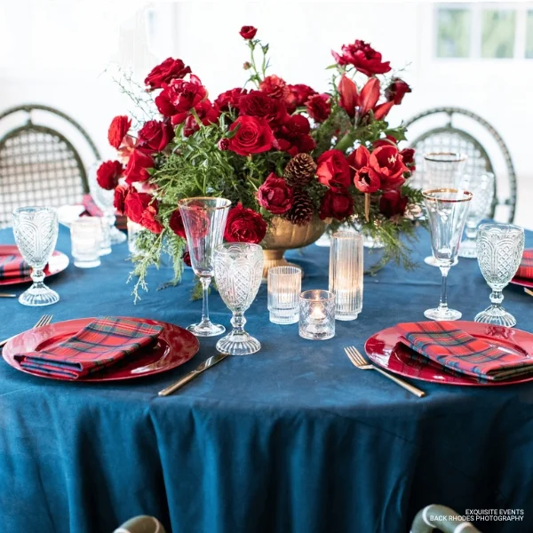 A table setting with Tartan Plaid Holly Berry Napkins available for table linen rental.