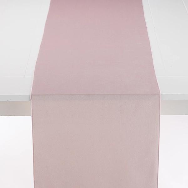 A Velvet Blush Table Runner on a white event linen rental table.