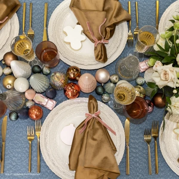 An event Velvet Hazel rental offering a table with plates and silverware.