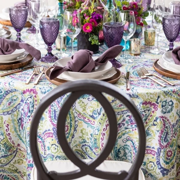 A elegantly appointed Remi Jewel table set for a dinner party, featuring exquisite event linen rental.