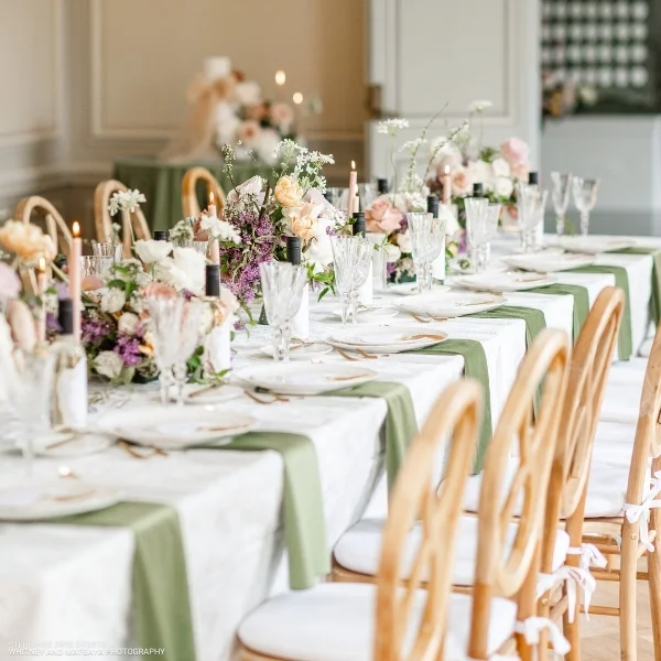 A beautifully adorned Velvet Evergreen table set for a wedding, featuring elegant Velvet Evergreen table linens available for event linen rental.