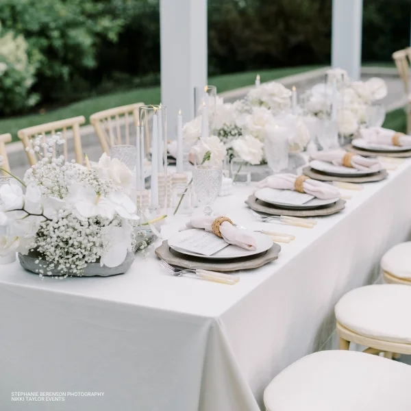 A white and gold Velvet Pearl table linen rental for a wedding.