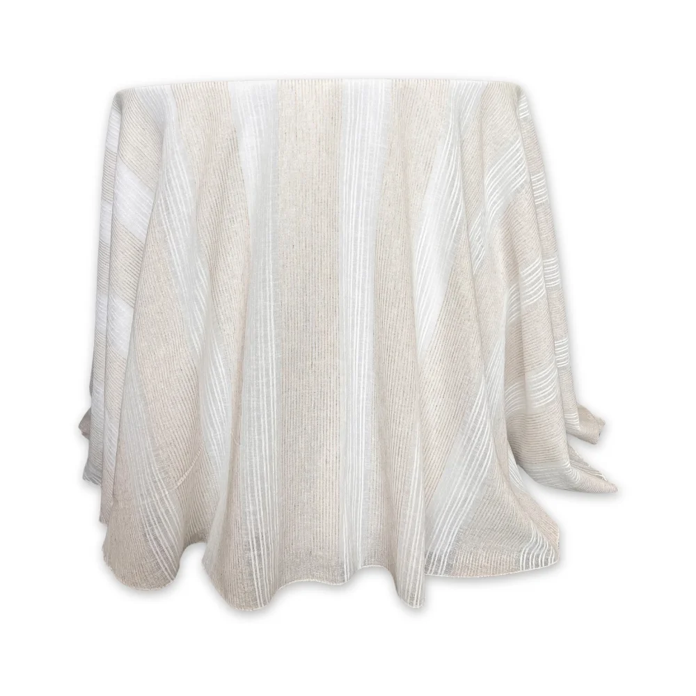A Montauk Sand Overlay with a striped pattern draped over an object, isolated on a white background.