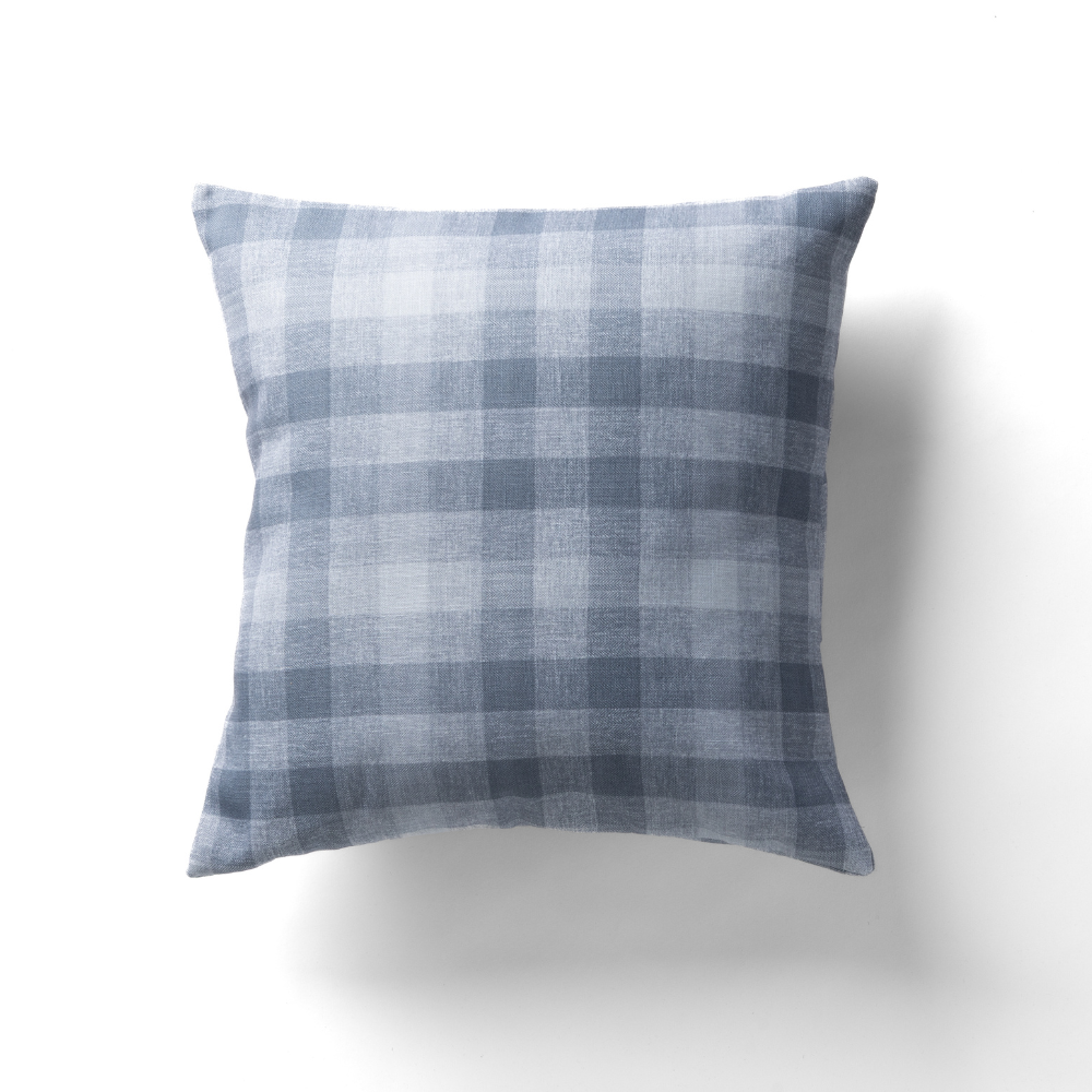 The Checkered Plaid Harbor Pillow features a square design with a blue and white plaid pattern on a plain white background.